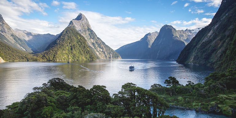 Milford sound peaks with cruise ship approaching