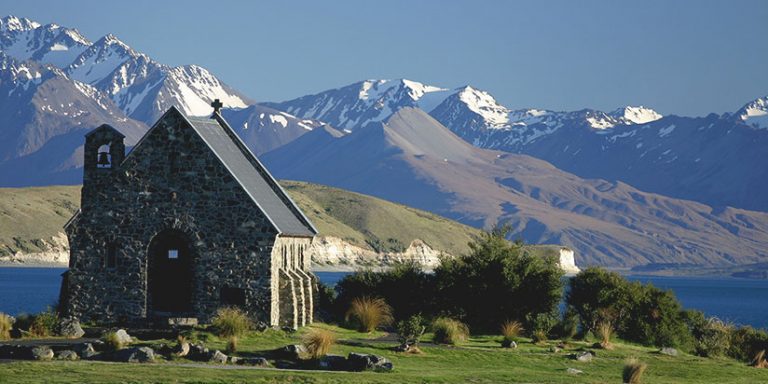 Church of the Good Shepherd with Lake Tekapo and mountains in the background